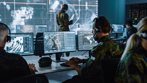 Military,Surveillance,Officer,Working,On,A,City,Tracking,Operation,In