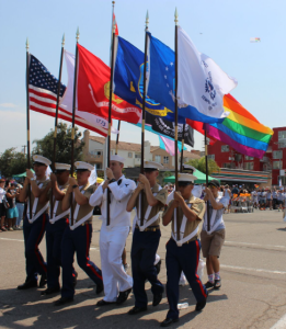 2023_07_15_16_25_53_military_parade_with_with_pride_flag_LGBTQ