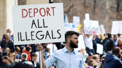 Angry,Man,Hold,Deport,All,Illegals,Banner.,Immigration,Crisis,Protest.